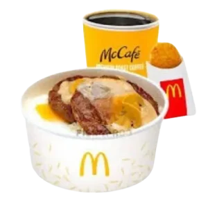 McDonald's 2-piece Mushroom Pepper Steak served with garlic rice, egg, hash browns, and a coffee. Price: ₱214. Calories 780 in the Philippines.
